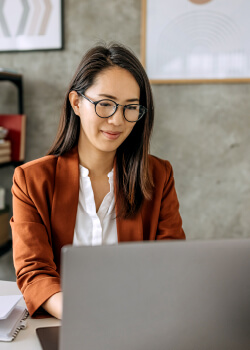 woman looking at her laptop