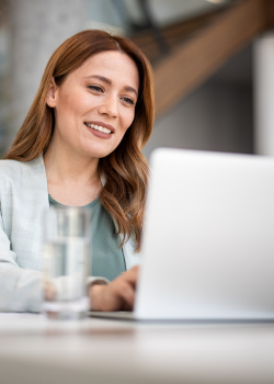 woman looking at her laptop