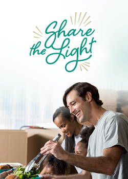 A man cooking with family