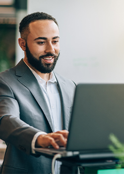 A businessman looking at his laptop