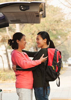 A mom and daughter hugging