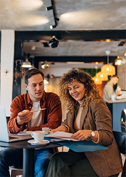 A man and a woman sitting at a cafe