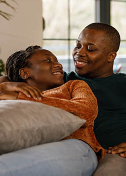 A couple smiling at each other