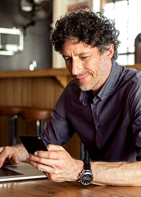 A man looking at this phone