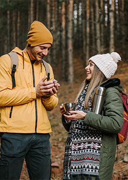 A man and a woman camping 