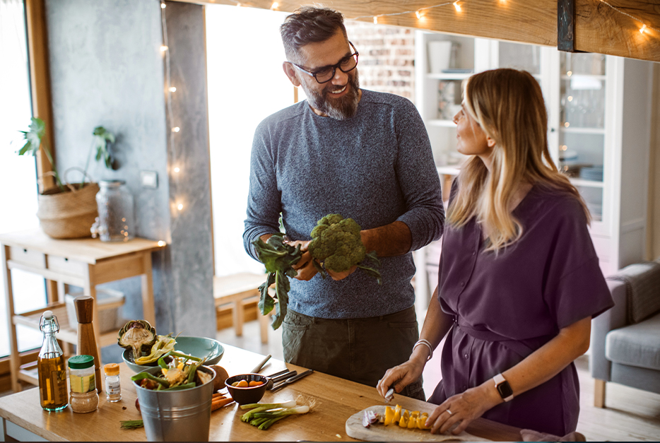 Couple making food together