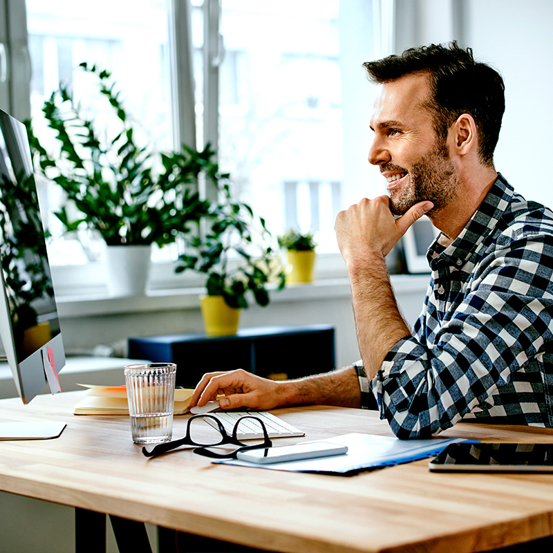 Man checking his investments on his desktop