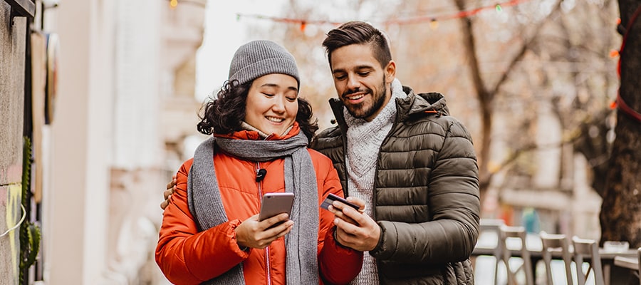 Two people walking outdoors in the winter