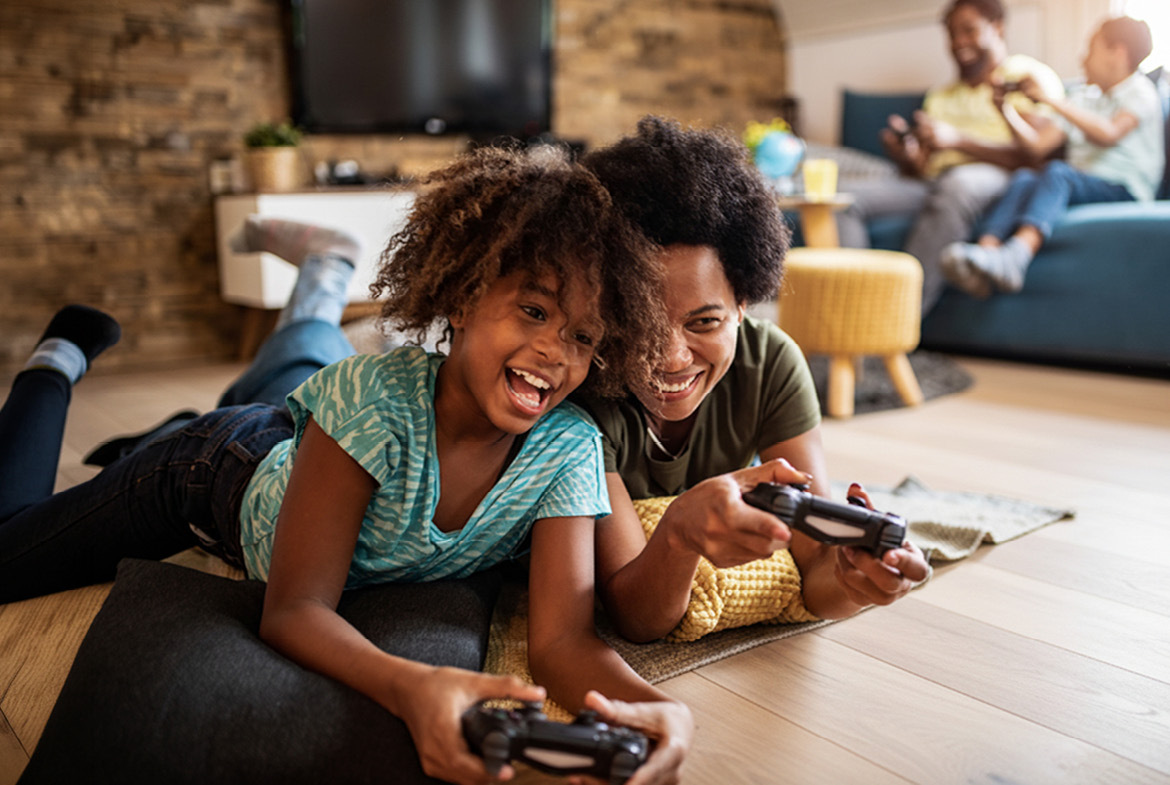 Mom and daughter playing video games