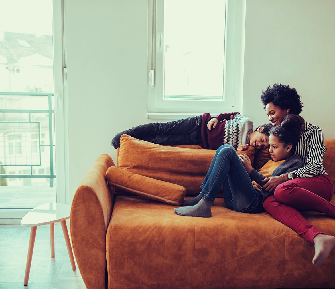 Family lying on couch