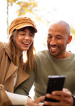 A couple looking at their phone