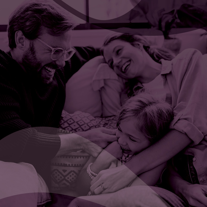 young family on the couch together