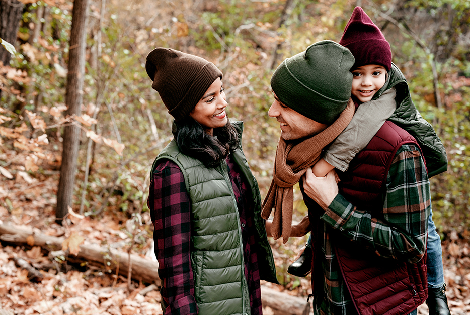 Family hiking in the woods together