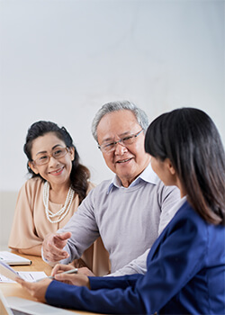 women chatting with an elderly couple