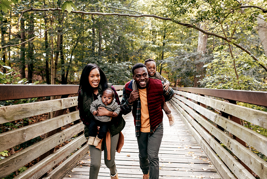 Family walking on a bridge together