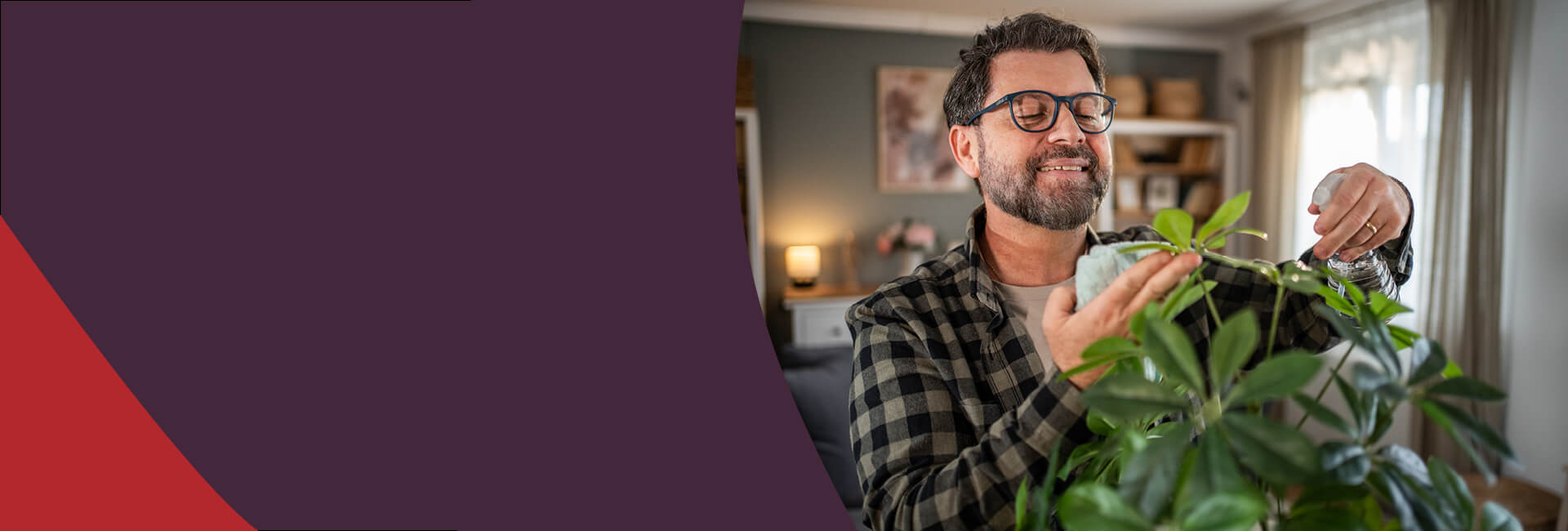 man watering his plants