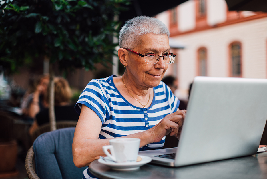 Woman sitting in a cafe with her laptop