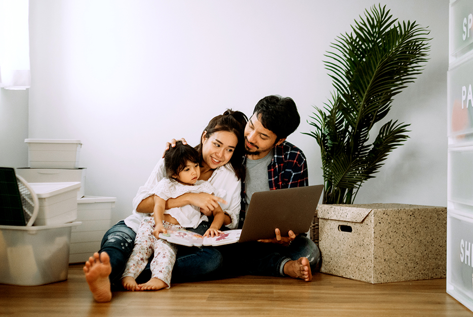 Young family sitting together on the floor