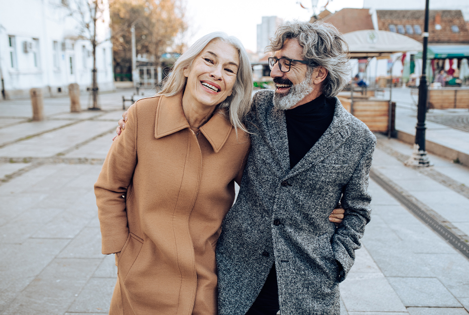 Couple walking down the street together