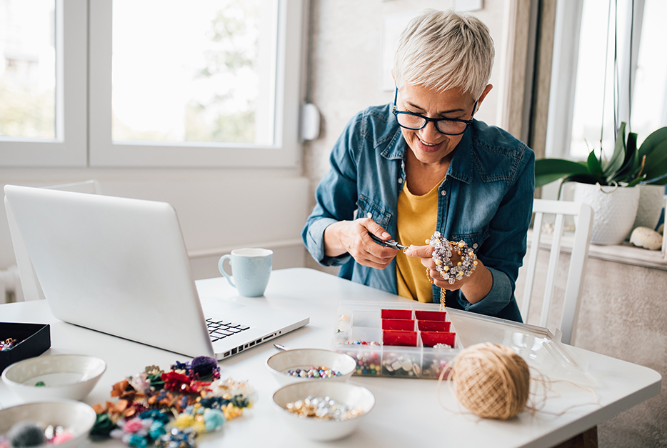 Woman making homemade jewelry 