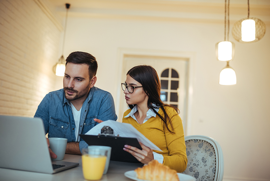 Couple sitting and planning a budget together