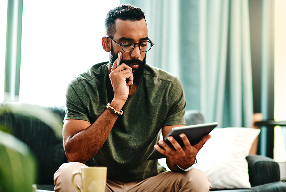 Man writing on his tablet