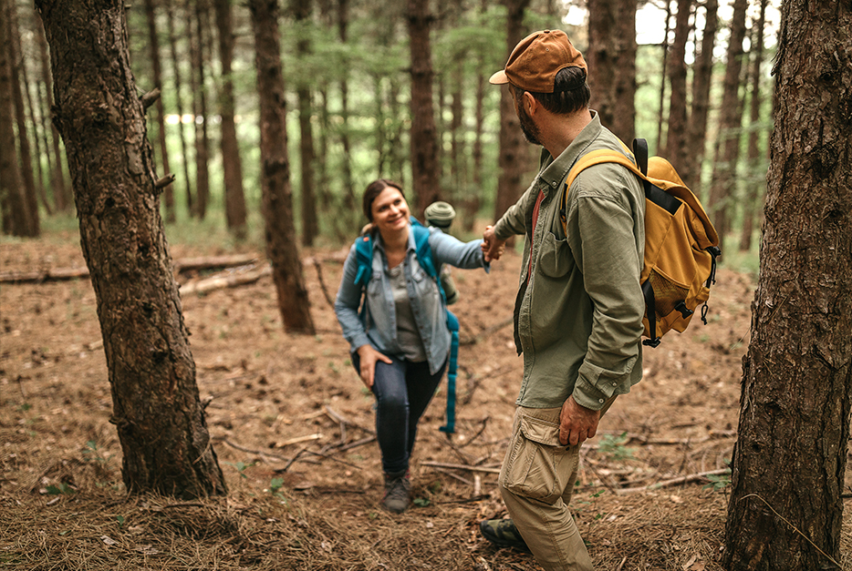 Couple hiking in the woods together