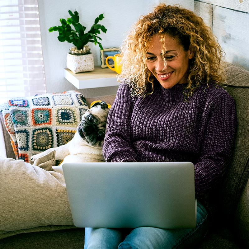 Woman smiling while on her laptop