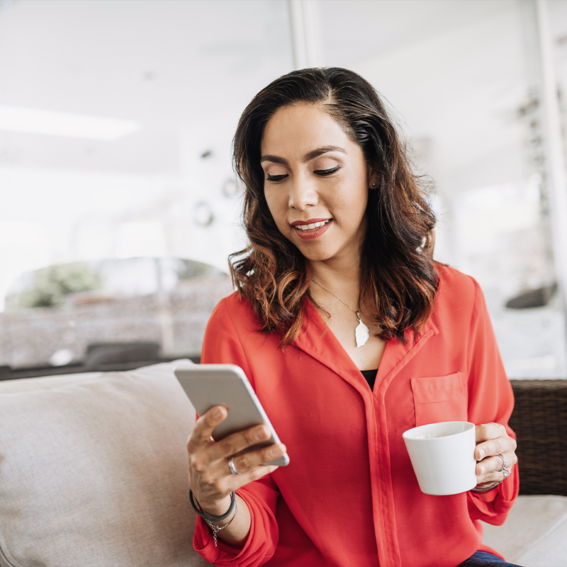 Woman looking at her phone and smiling