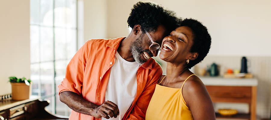 couple in the 60s laughing together