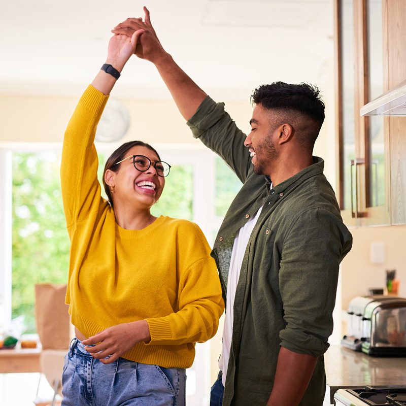 couple dancing in their house