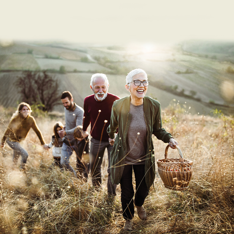 Family walking in a field together