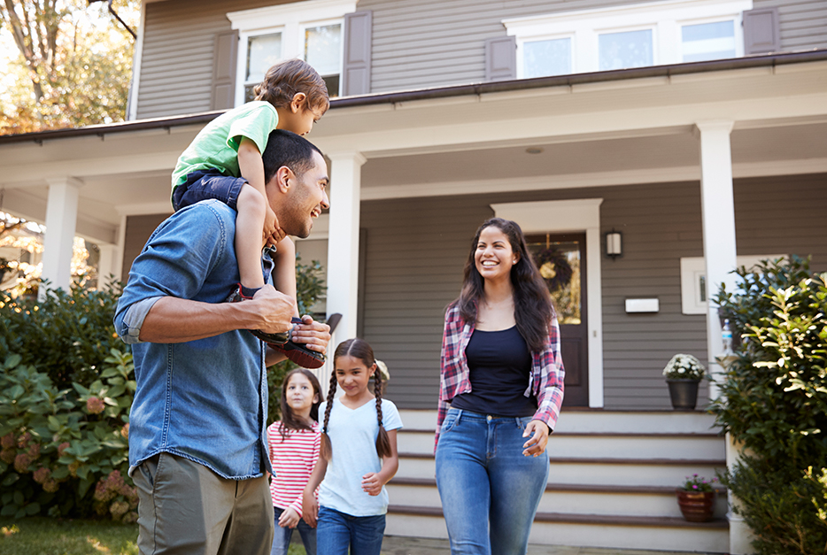 Family walking down their house steps together