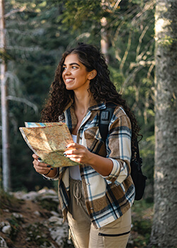 A women standing holding a map