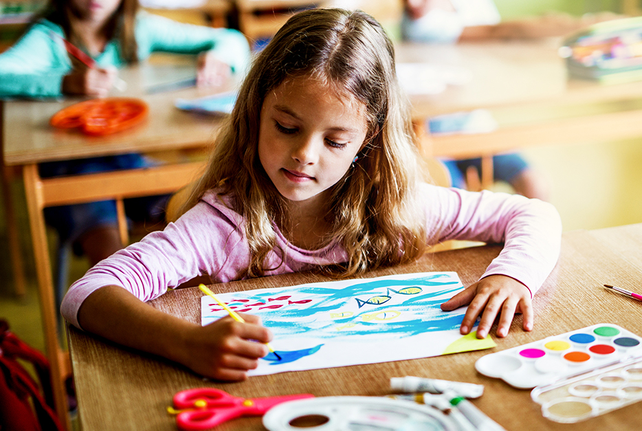 Child colouring a picture