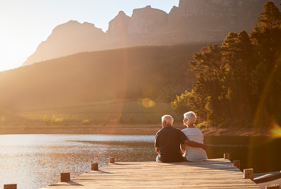 Couple sitting on a dock together