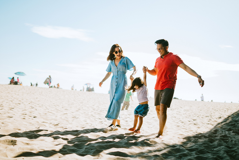 Family walking on the beach